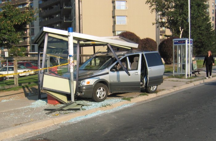 Van in the bus shelter... ouch